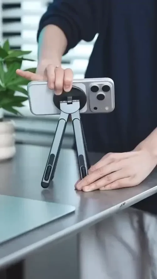 Foldable stand holding a phone upright