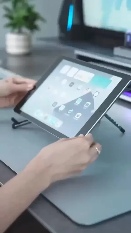 Foldable stand holding a tablet on a desk