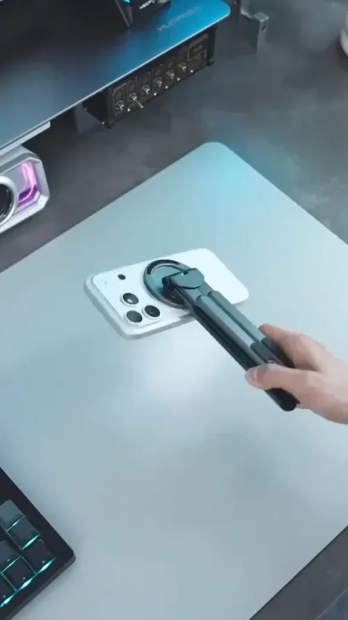 Foldable stand attached to the back of a phone