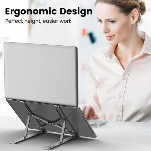 Woman working on a laptop raised on an adjustable laptop stand
