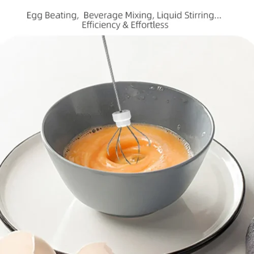 Coffee beater egg whisk head beating eggs in a bowl