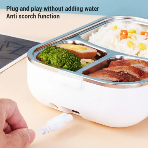 Plugging in the electric lunch box to heat food