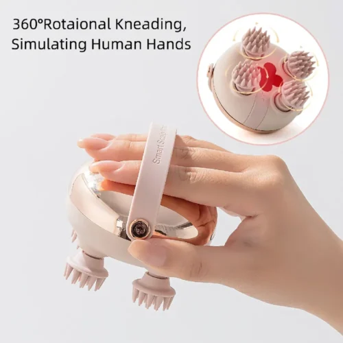 Hand holding the rechargeable scalp massager by its strap