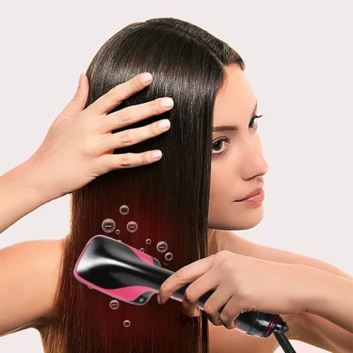 Hot air brush smoothing long straight hair