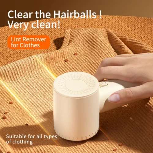 Lint remover removing fuzz balls from a knitted sweater