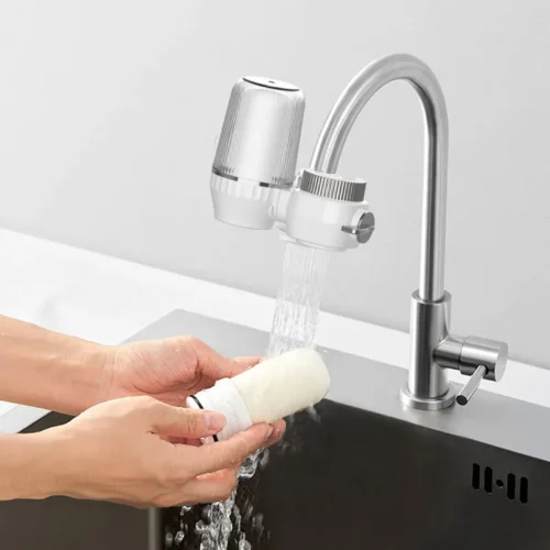 Rinsing the washable outer layer of the tap water filter cartridge