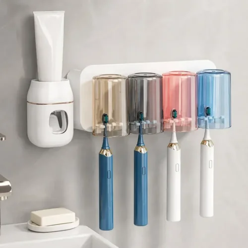 Toothpaste dispenser set mounted above a basin